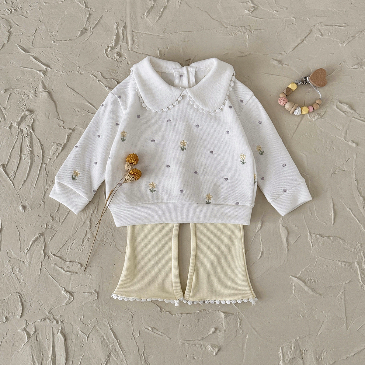 Floral doll collar long sleeved top+solid color flared pants lace hem two-piece set