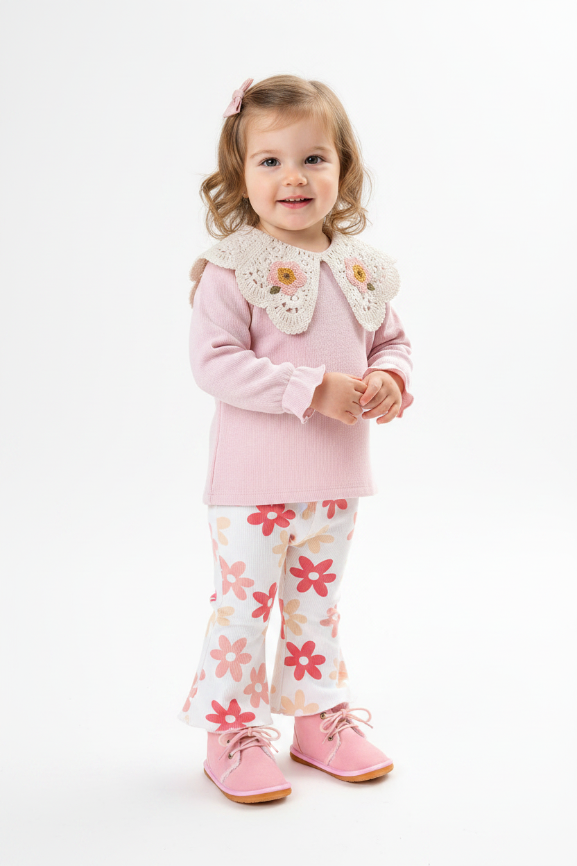 Toddler wearing pink crochet collar top, floral flares and pink boots